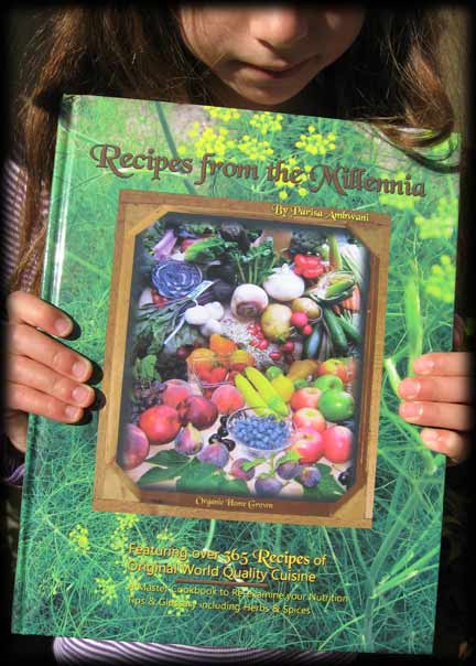 Girl holding book "Recipes From the Millennia"